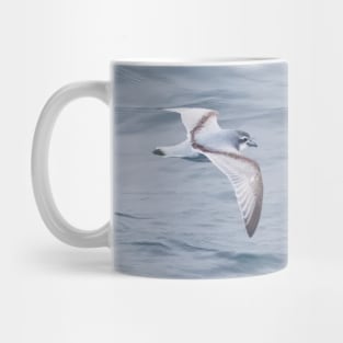 LITTLE BLUE BIRD FLYING OVER BIG BLUE OCEAN Mug